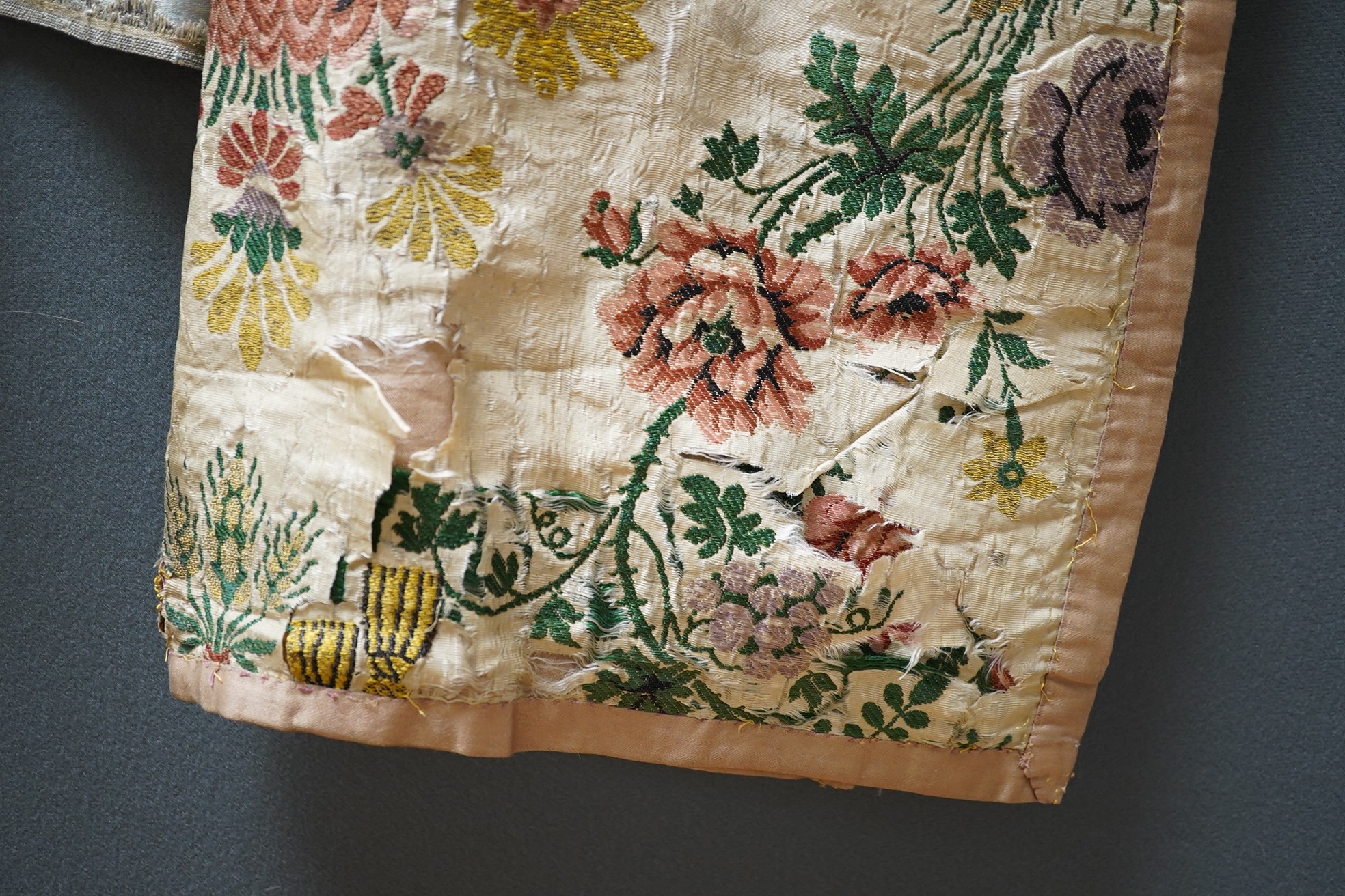 Samples of 18th century French, possibly Lyon silk, short loom brocades including two pairs and three single samples of varying sizes, one pair multi polychrome of large exotic flowers and fruits, the other pair pale blu